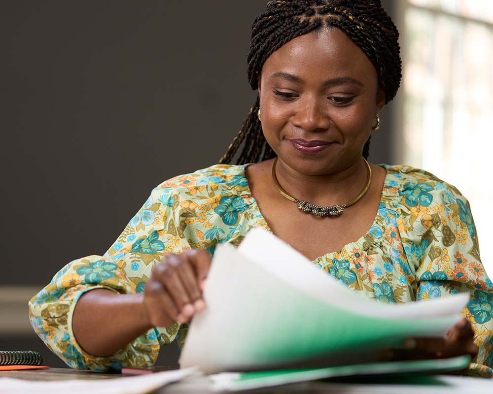 A person looking through notes.