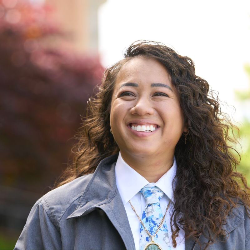 A person smiling outside.