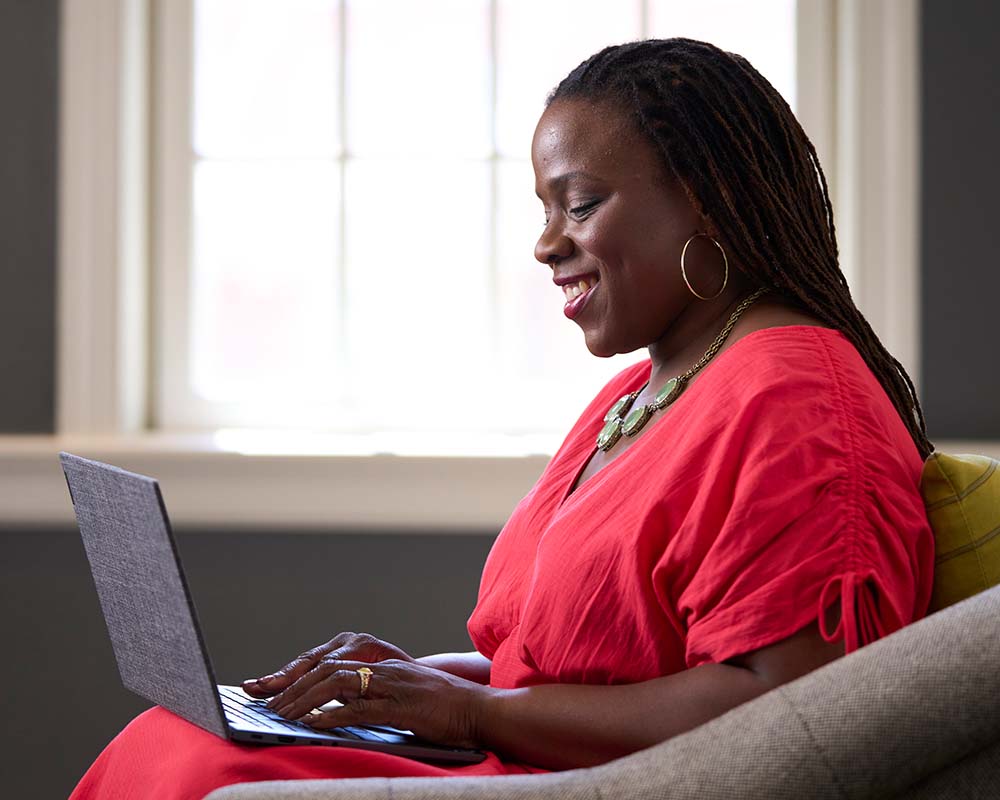 A person typing on a laptop.